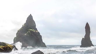 reynisdrangar cliffs in reynisfjara beach