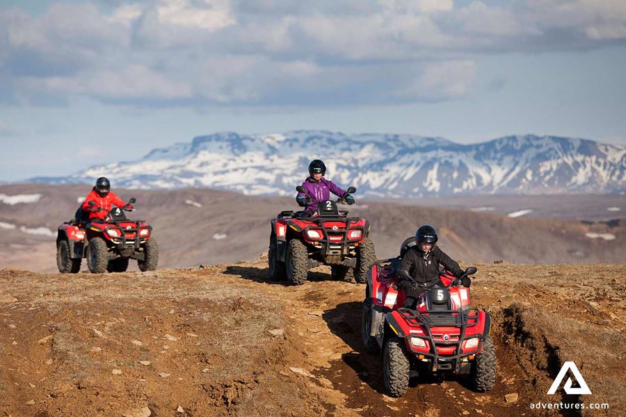 atv riding through mountain roads in winter