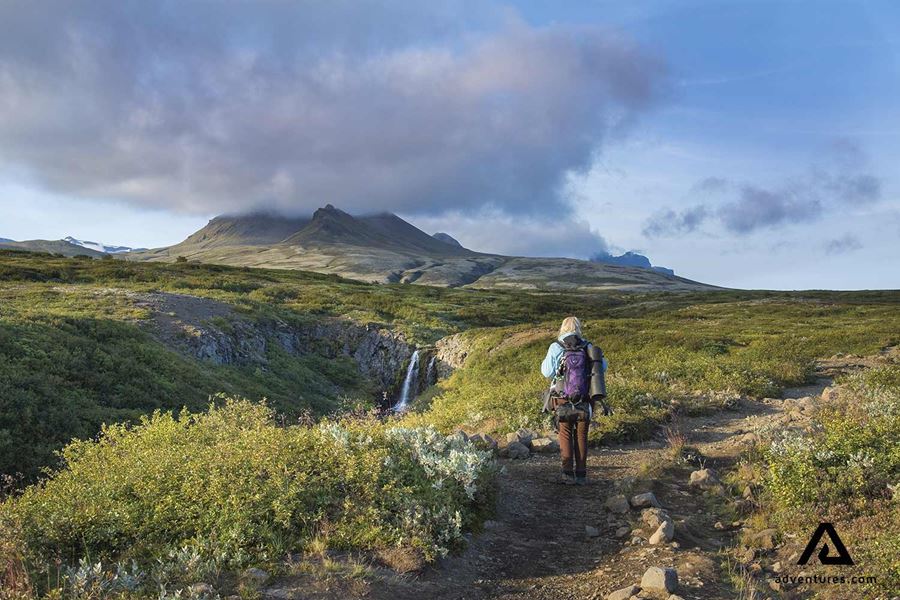 woman hiking towards svartifoss