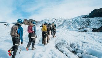 Small group tour hiking towards glacier crevasses at Vatnajokull.