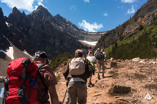group of backpackers in mountains hiking