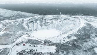 Parking Lot Next To Kerid Crater And The Crater Itself covered in snow
