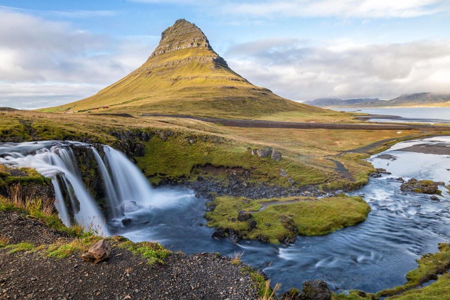 Kirkjufell mountain by Snaefellsnes in early spring, with two small waterfalls.