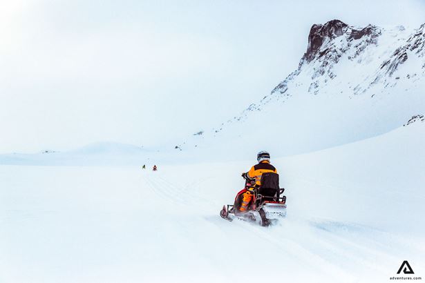 Man riding snowmobile