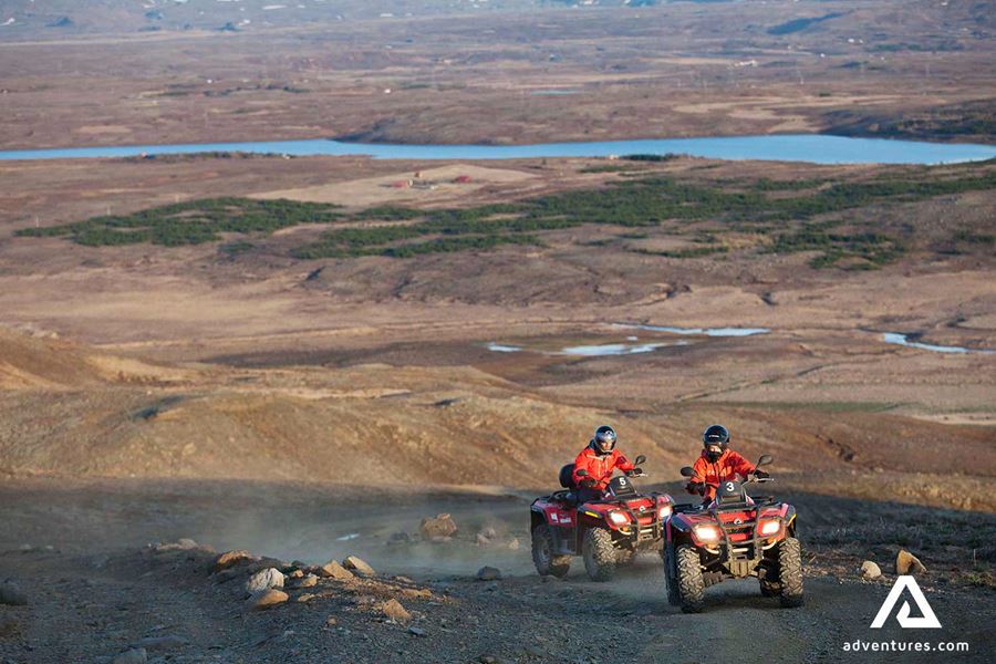 view from a mountain of people riding atvs