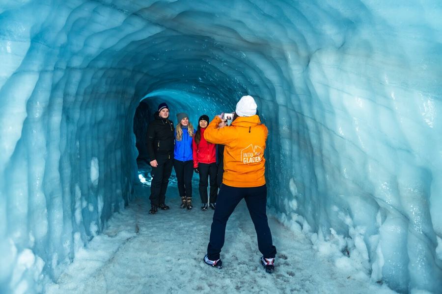 Small group tour posing for photos inside Langjokull ice tunnel 