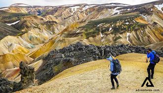 two friends hiking in landmannalaugar mountains