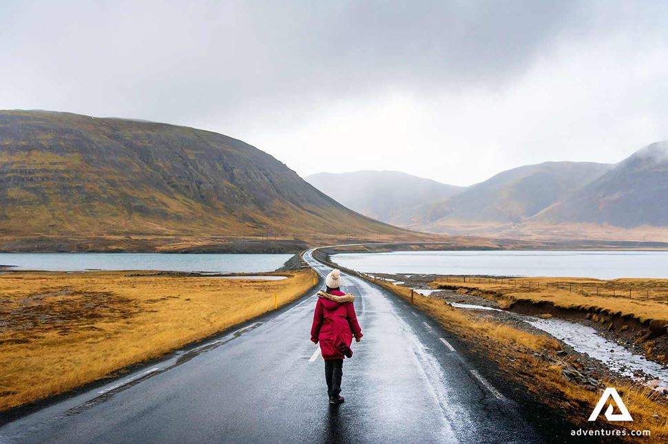 Woman Walking in Snaefellsnes Peninsula on the road