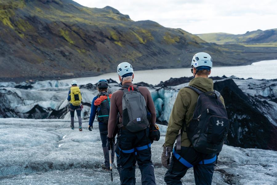 People walking down the glacier in Iceland