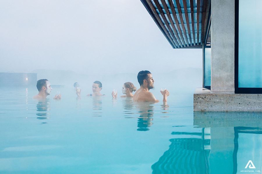 people bathing near a bar at blue lagoon