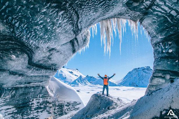 Man with a raised hands from Katla Ice Cave