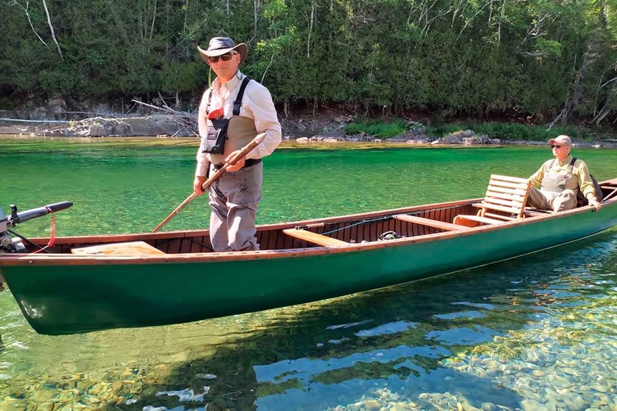 Two men in a wooden boat