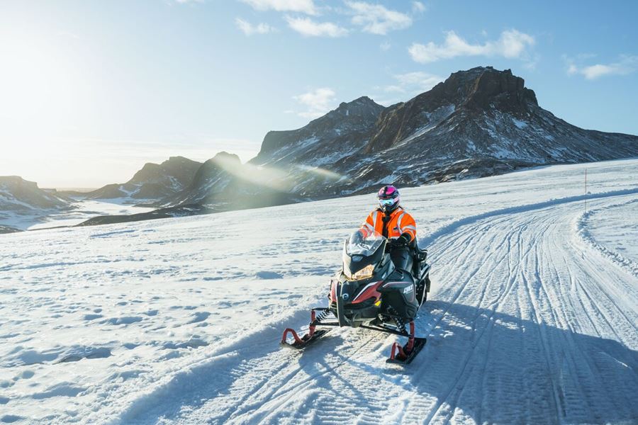 Driving On A Snowmobile On Langjokull Glacier