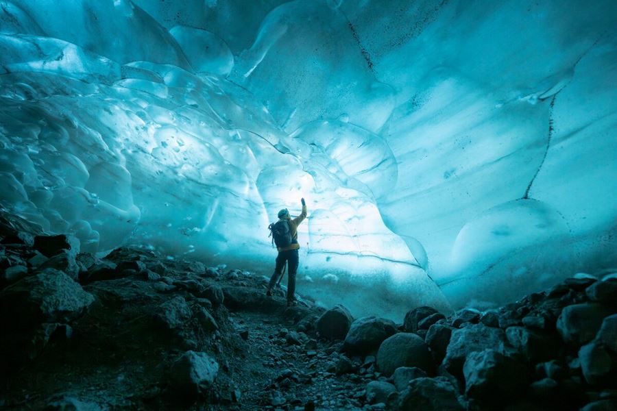 Light turquoise blue ice cave walls in ice cave at Vatnajokull glacier