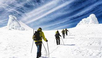 people hiking to the top of snaefellsjokull glacier mountain