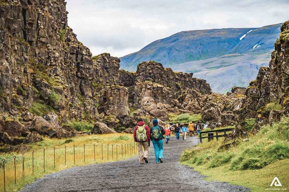 tourists walking around thingvellir national park